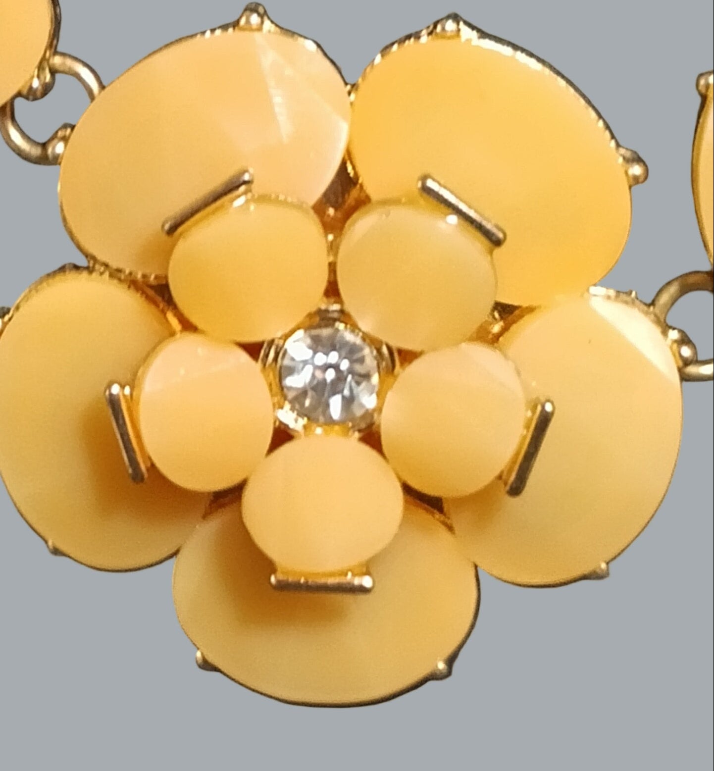 Natasha Gold Floral Rhinestone Statement Necklace.”